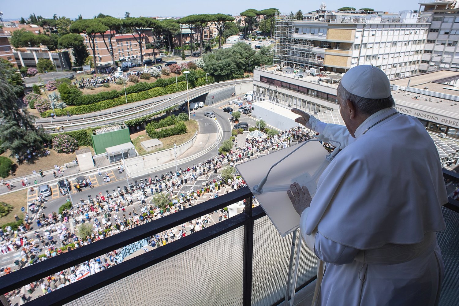 Pope Francis greets the crowd as he leads the Angelus from a balcony of Gemelli hospital in Rome July 11, 2021, as he recovers following scheduled colon surgery.